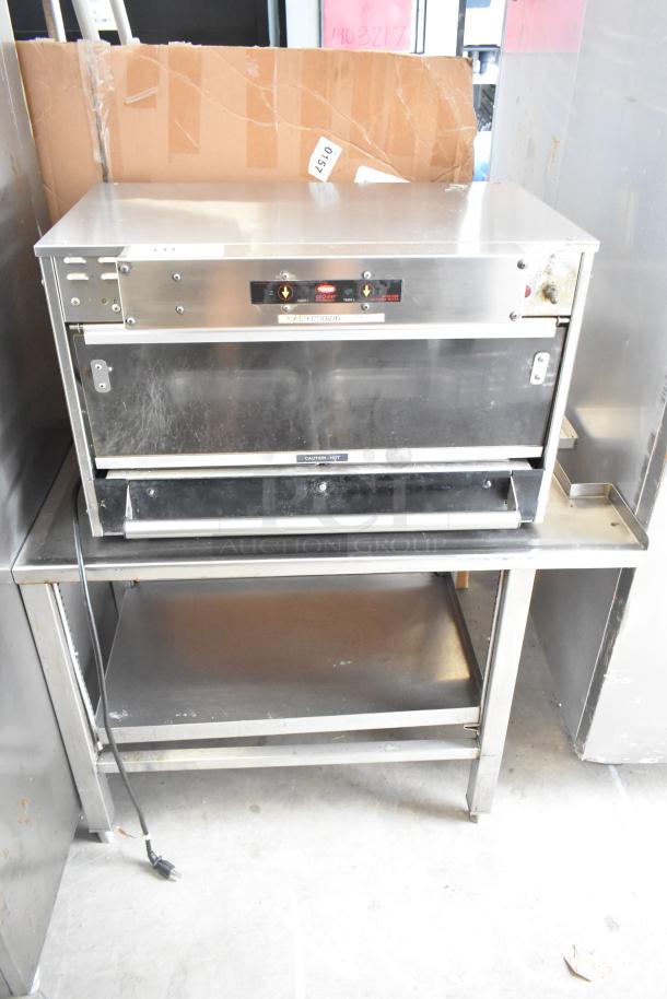 Hatco GRMW-3 Glo-Ray stainless steel warming display merchandiser. 120V, 1 phase, on an equipment stand.