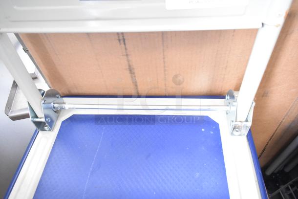 Franklin 19"x29" folding platform truck in good condition, blue base, metal frame, ideal for heavy loads.