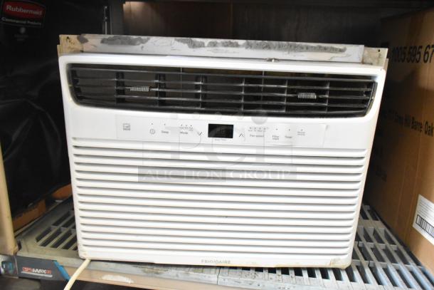 Electrolux FFRE1033U1 window AC, 115V, used condition, visible controls and digital display, minor wear on casing.