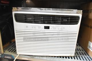 Electrolux FFRE1033U1 window AC, 115V, used condition, visible controls and digital display, minor wear on casing.