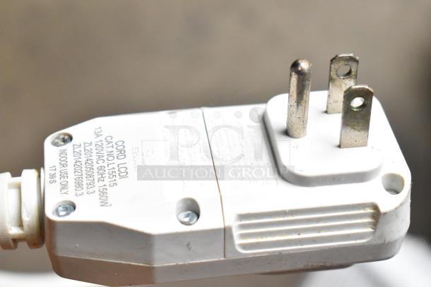 Electrolux FFRE1033U1 air conditioner plug with visible label details; 115V, 1 phase; indoor use only.