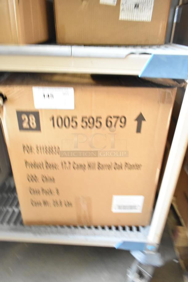 Cardboard box labeled "Camp Hill Barrel Oak Planter," showing scratches and dents. Contains a brand new set of pastry boxes.