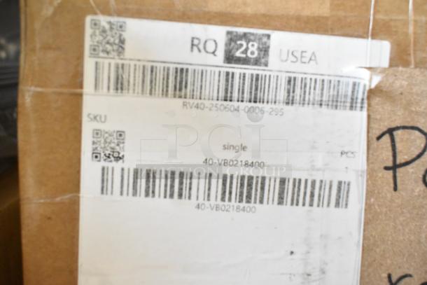 Cardboard box with shipping label for a brand new, scratch and dent portable tyre regroover. Label includes QR codes, SKU 40-VB0218400.