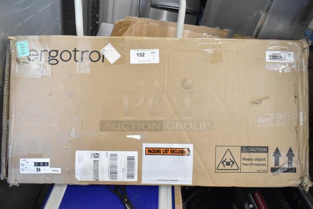 Brown cardboard box labeled "33-349-200 Ergotron." Condition: scratch and dent. Tags: caution for heavy object, packing list enclosed.