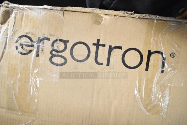 Brand new Ergotron 33-349-200 computer workstation box with visible scratch and dent damage.