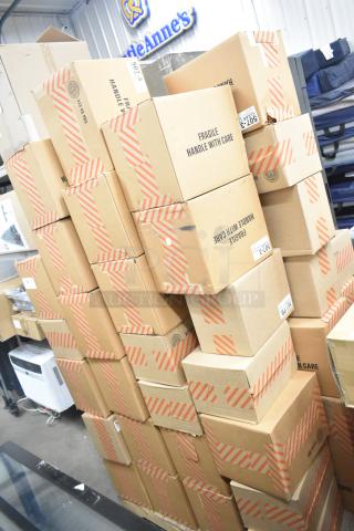 66 boxes of 507-3 clear 7" disposable tongs, brand new. Each box contains 100 individually bagged tongs, marked fragile.