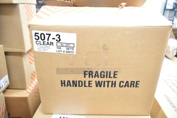 Box of 100 clear 507-3 disposable 7" tongs, individually bagged. Label shows "LOT #20073" and "Handle with Care."