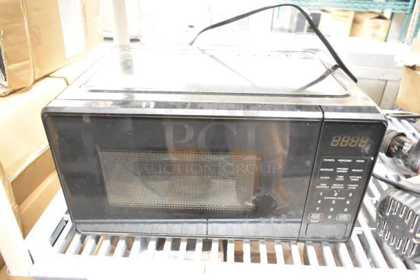 Countertop microwave oven, model MSF0B100072352, with keypad controls and digital display. Includes plate. 120 Volts, 1 Phase.