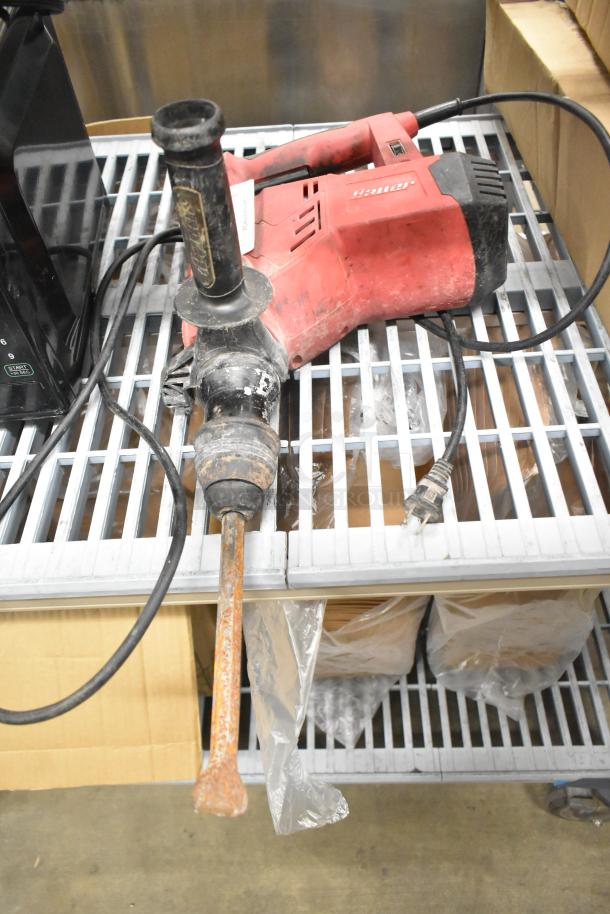 Bauer 1641E-B rotary hammer, 1-1/8", 120V, variable-speed, visible wear, red body, corded, with side handle.