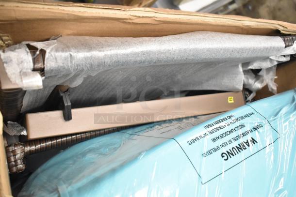 BRAND NEW SCRATCH AND DENT OP70261TU Costway patio rattan lounge chair partially unpacked with protective wrap.