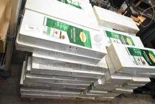 71 brand new scratch and dent Vigoro rectangular plant stands in boxes. Quantity tags indicate auction lot of 71.