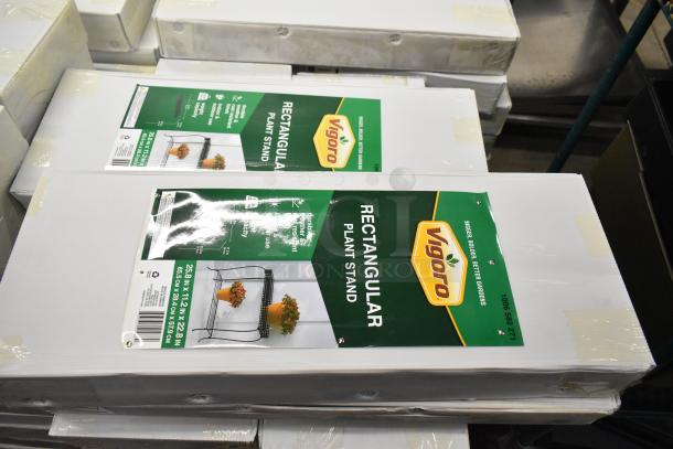 Alt text: Vigoro Rectangular Plant Stand packaging, brand new condition, labeled for outdoor use, packs of 71 total stands.