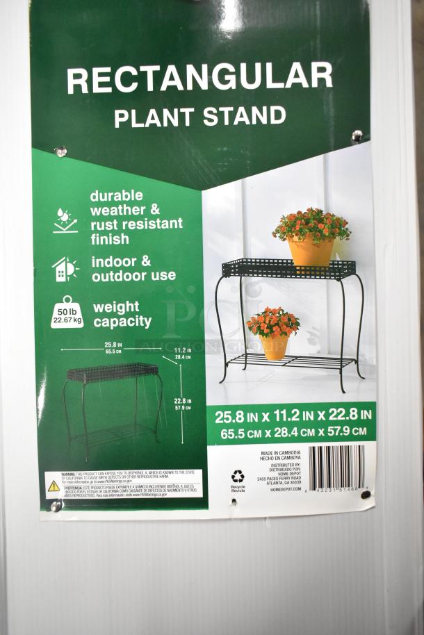 Brand new Vigoro rectangular plant stand with durable weather and rust-resistant finish, measuring 25.8x11.2x22.8 inches.