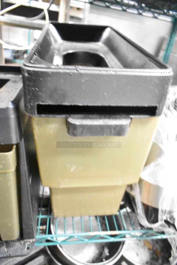 Two-tier lot with beverage holder dispensers and rice cooker inserts on a metal shelf. Items show light wear.