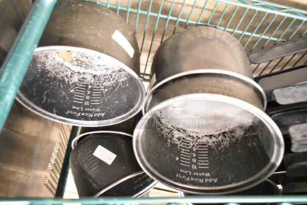 Two-tier lot with beverage holder dispensers, rice cooker inserts. Visible wear, measurement markings on inserts.