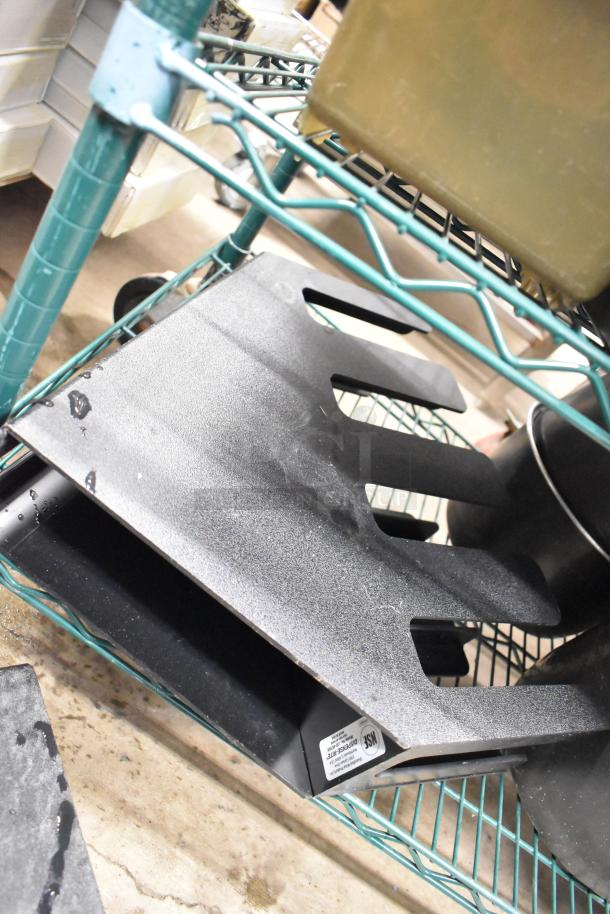 Two-tier lot with black beverage holder dispensers and metal rice cooker inserts on a green wire shelving unit. Visible label: NSF certified.