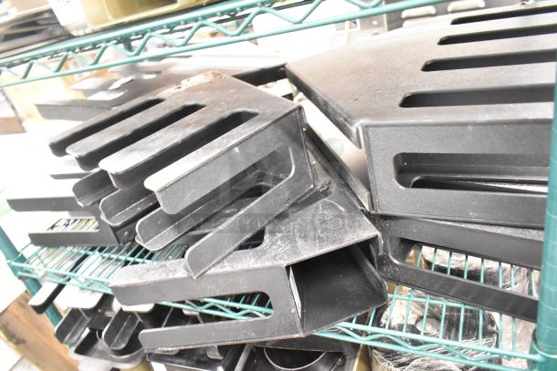 Two-tier lot of stainless steel drop-in bins and black lid organizers on a metal shelf, used condition.