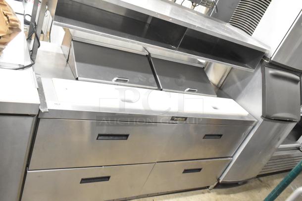 Delfield UCD4464N-12-DD5 stainless steel prep table with bain-marie mega top, over shelf, 4 drawers, on commercial casters.
