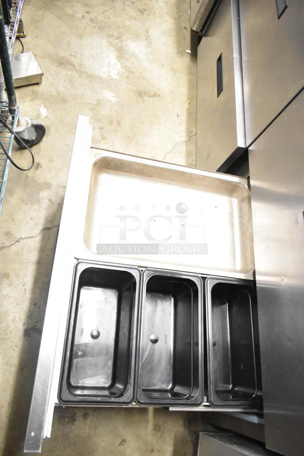 Delfield UCD4464N-12-DD5 stainless steel commercial prep table with 4 drawers, integrated bain marie, and overshelf.