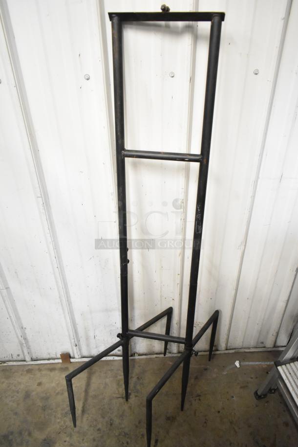 Tall metal stand with pointed legs, intended to hold a decorative eagle. Simple design, excellent condition.