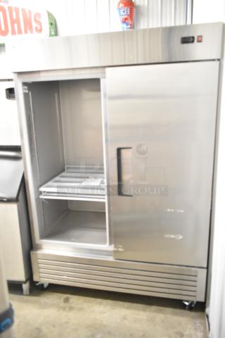SL55R stainless steel commercial 2-door cooler on casters, missing one door. Features poly coated racks, 115V. Model SL55R.