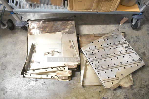 6 metal oven pieces, mixed conditions, rectangular and perforated, with handles. Auction tag "171" visible.
