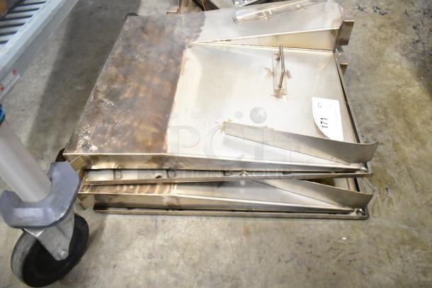 Six metal oven components stacked on the floor; visible wear. Label reads "Lot 171." Suitable for industrial use.