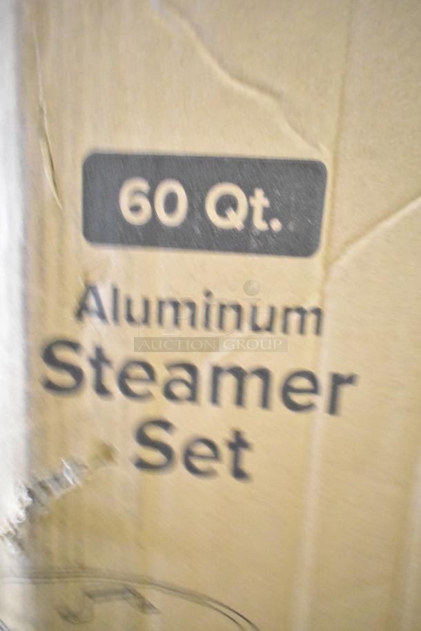 Brand new 60 Qt. Choice aluminum stock pot with steamer basket and cover. Scratch and dent condition. Box labeled "Aluminum Steamer Set."