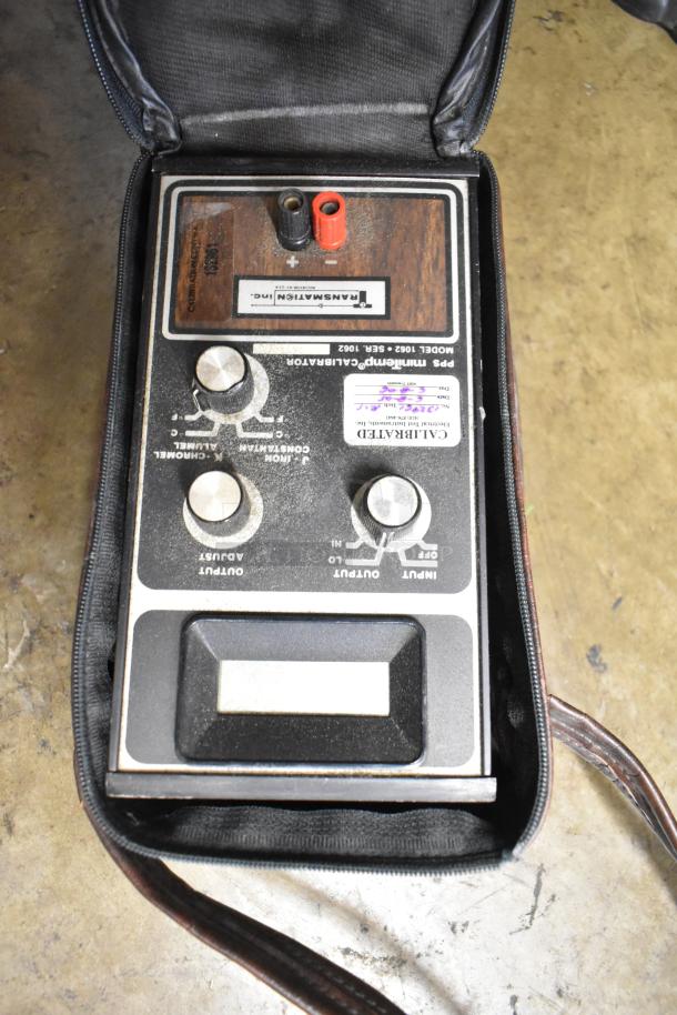 MiniTemp Calibrator Model 1062 in carrying case. Features include adjustment knobs and input/output jacks. Slight wear visible.