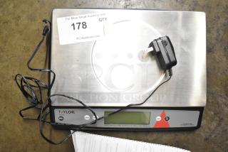 Taylor TE22OS countertop scale, includes power adapter, digital display, good condition, model labeled on front.