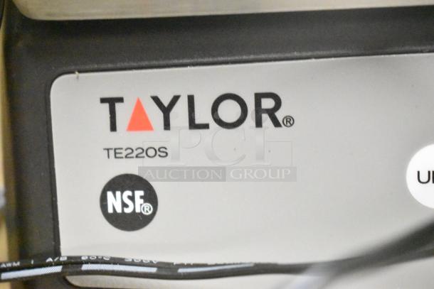 Taylor TE22OS Countertop Scale label, featuring the Taylor logo, model number, and NSF certification mark.