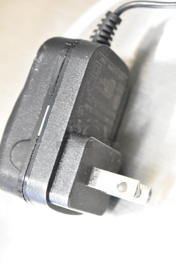 Plug for Taylor TE22OS Countertop Scale, black, two-prong, with visible wear. Essential for scale operation.