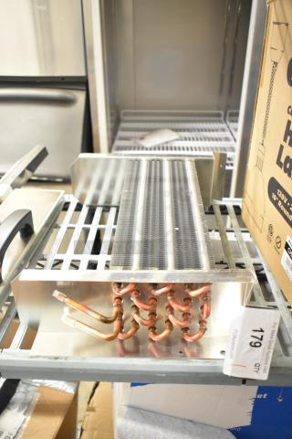 Brand new XCCC 6R4K350L/7.94 evaporator coil with minor scratches. Copper tubing, metal fins, auction tag visible.