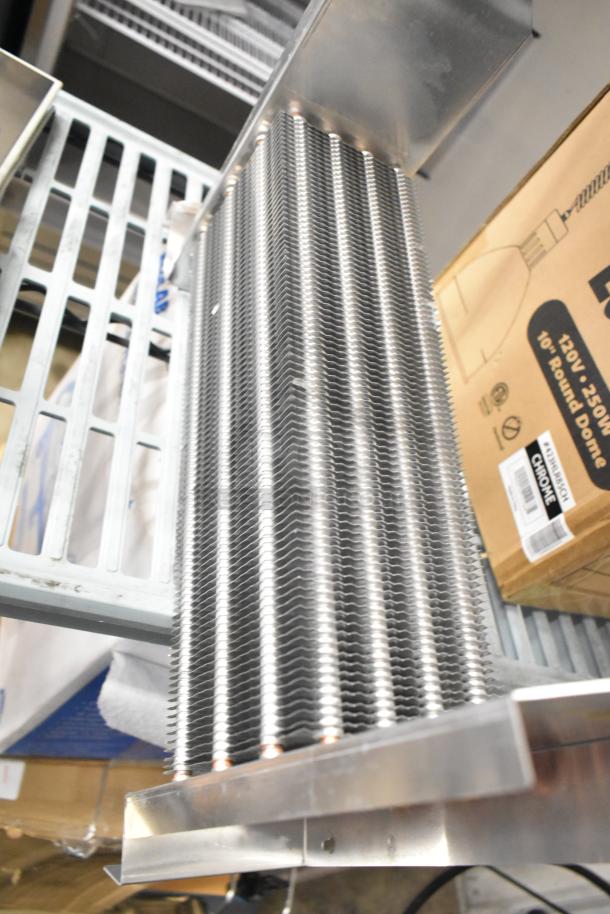 Brand new XCCC 6R4K350L/7.94 evaporator coil; scratch and dent condition, aluminum fins, industrial use, visible box.