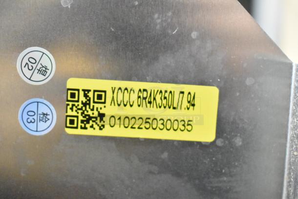 BRAND NEW XCCC 6R4K350L/7.94 evaporator coil with minor scratches, QR code, and serial number 010225030035 visible.