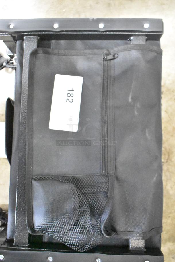 Black Sport Beats seat cushion with zippered pocket and mesh pouch, slightly worn. Label reads "182 qty."