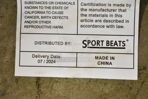 Alt text: "Sport Beats Seat Cushion label showing delivery date 07/2024, made in China, with safety warnings."