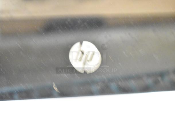 Blurry HP logo on an All In One Desktop, showing the front panel. Condition and other features unclear due to image quality.
