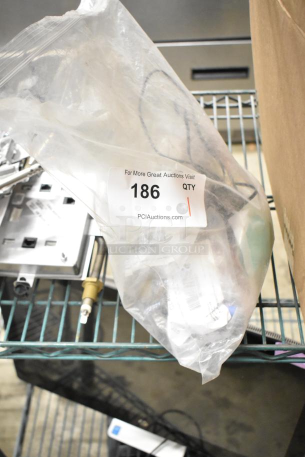 Lot of various items including CLS40FB-D pin connector and CL40FC series protective caps in clear bag, auction label 186.