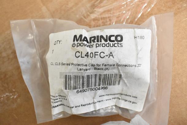 Lot of Marinco power products including CLS40FB-D pin connector, CL40FC series protective caps. Visible: CL40FC-A in packaging.