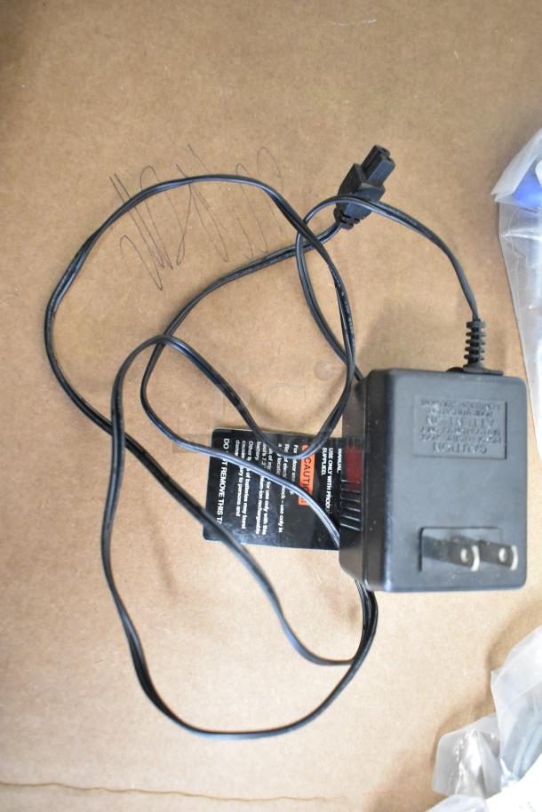 Lot includes power adapter with attached black cable, visible caution label. Includes CLS40FB-D pin connector, CL40FC caps.