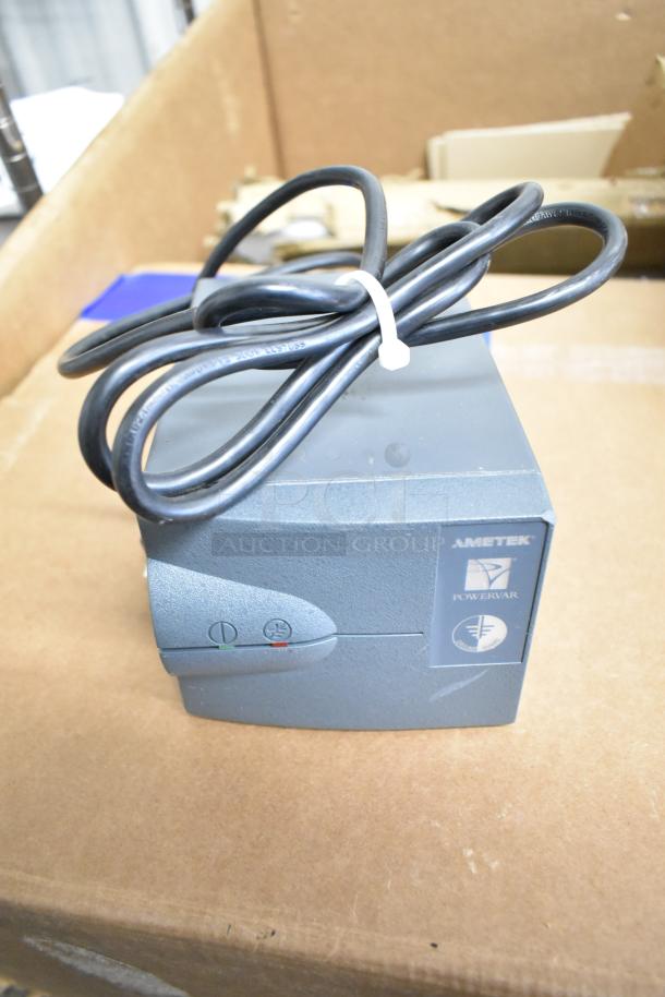 Powervar power conditioner with cord on top, Ametek branding visible, used condition, part of a 10 item auction lot.