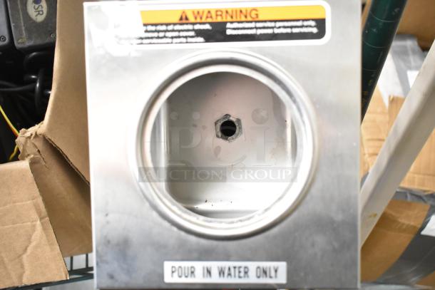 Bunn OHW 02550.0003 stainless steel pourover hot water machine. Features include a water inlet labeled "Pour In Water Only." Warning tag visible.