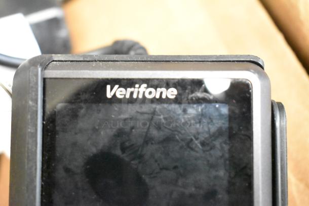 Verifone credit card reader, slightly worn. Includes Netgear box, Apple iPad, Astro Mixamp, Windows tablet. Auction set.