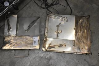 Two metal units with brushed finish, featuring handles and notches. Includes auction label "193" indicating bid multiplier.