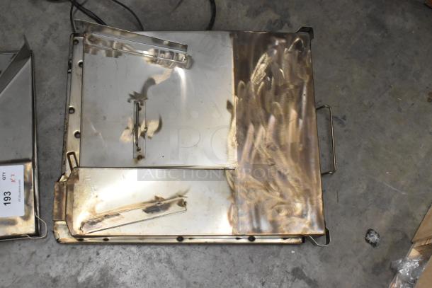 Two rectangular metal units with riveted edges and handles, partially polished, showing wear. Label reads "Qty 2, 193, PCIAuctions.com."