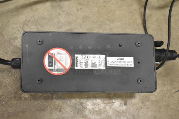 Rational LMZ200XX.AXX VarioSmoker with tags indicating 100-240V, 1 Phase. Includes warning label for carbon monoxide gas.