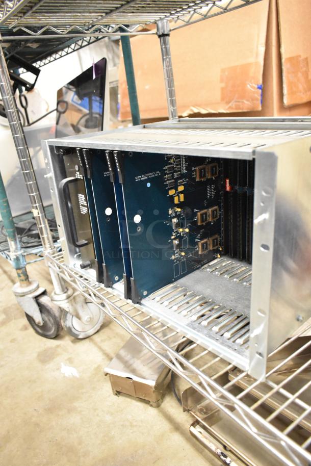 Sigma Electronics ADF-64A Unit in metal casing, visible circuit boards, good condition on wire shelving.
