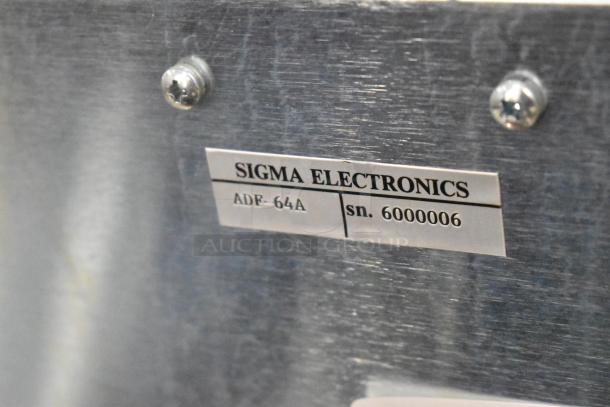 Sigma Electronics ADF-64A unit label showing model and serial number 6000006 on metal casing.