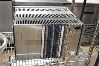 Analog & Digital Switchers A&D Unit with multiple input/output ports, metal casing, visible labels, in good condition.